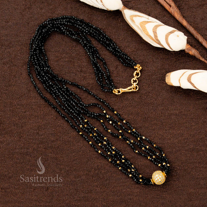 A classic temple-style one gram gold long necklace showcasing an ornate bold pendant, enhanced with noir black stone highlights, a statement jewellery piece for cultural celebrations - Sasitrends