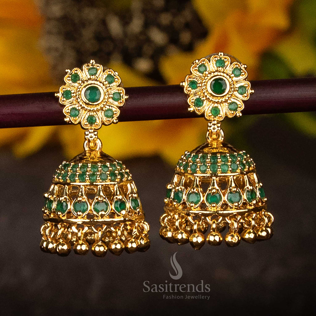 Graceful green AD stone studded flower jhumka earrings in micro gold plated finish with charming pearl drops – ethnic traditional jewellery perfect for bridal and festive looks – Sasitrends