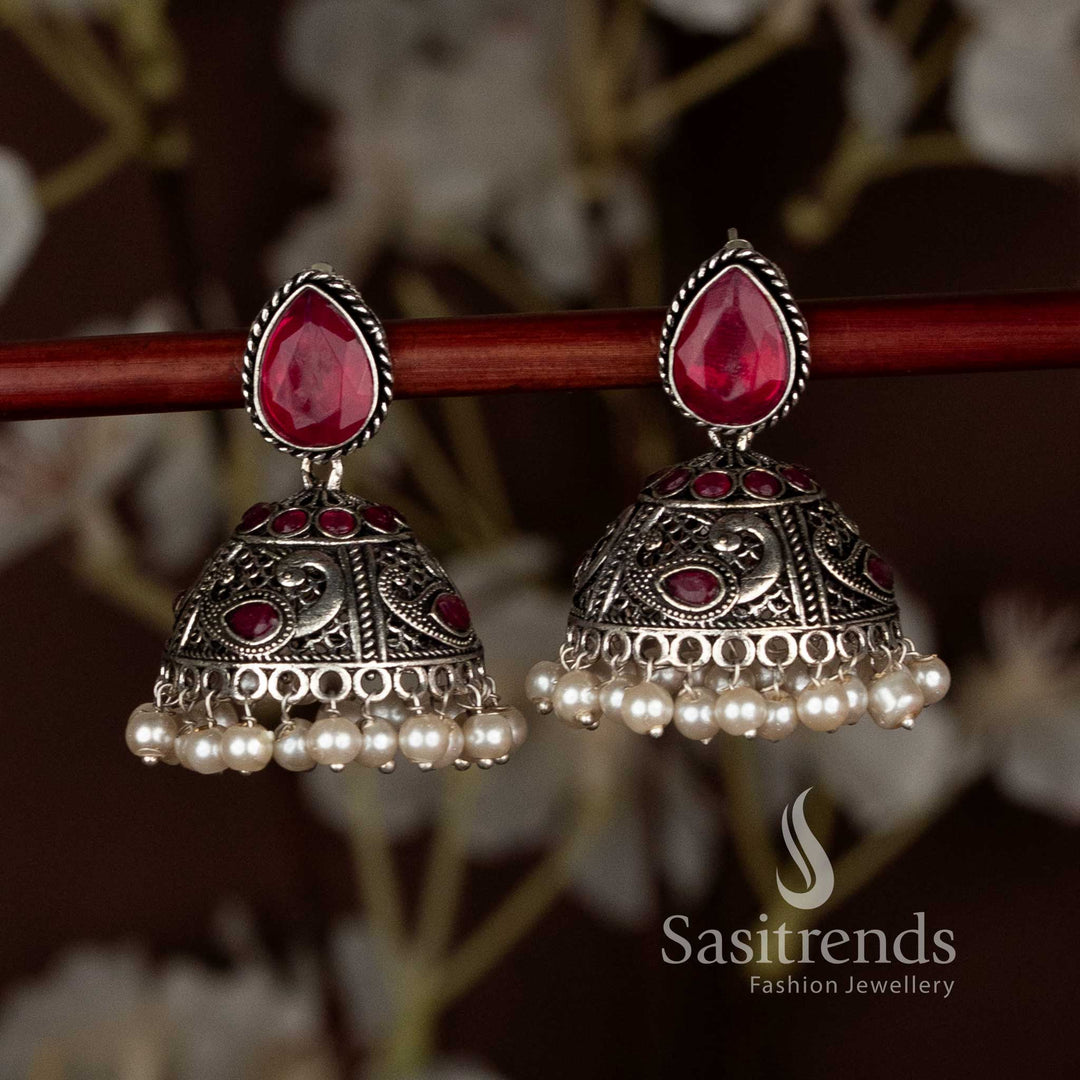 Ruby oxidised teardrop stud peacock motif jhumka earrings with pearl drops, ideal for ethnic saree wear and festive Navaratri charm with elegant detailing by Sasitrends
