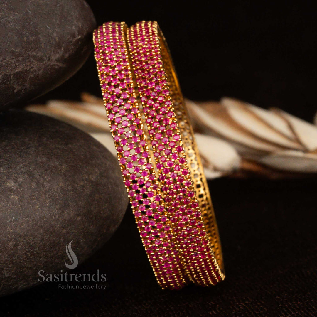 Micro gold traditional bangles with ruby red American diamond stones and detailed heritage-style carving – a perfect blend of grandeur and tradition in bridal jewellery by Sasitrends