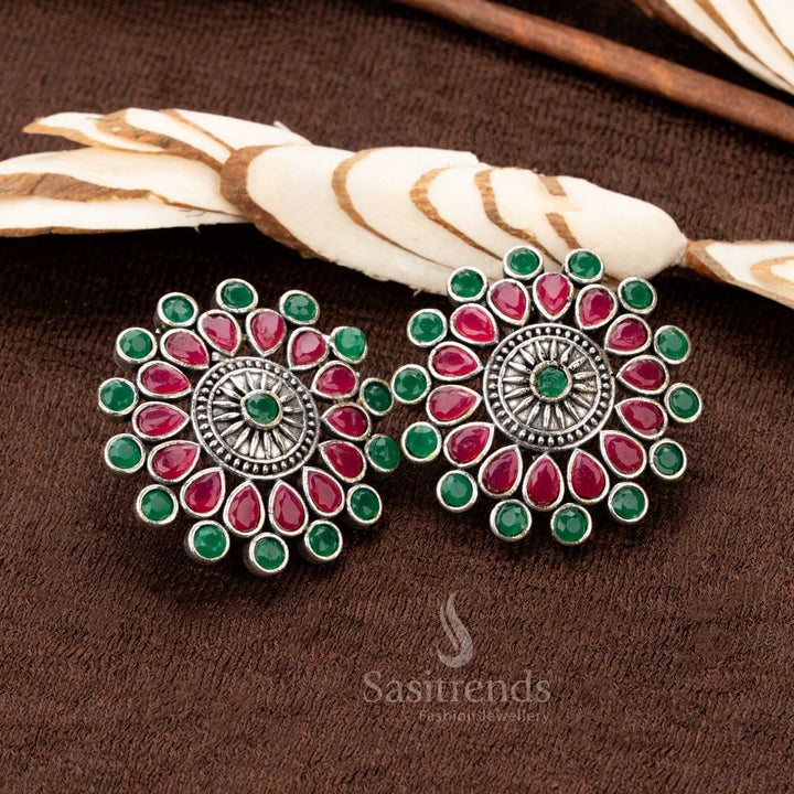 Antique oxidised German silver Earrings set featuring an intricately designed floral pendant with ruby and green gemstones - Sasitrends