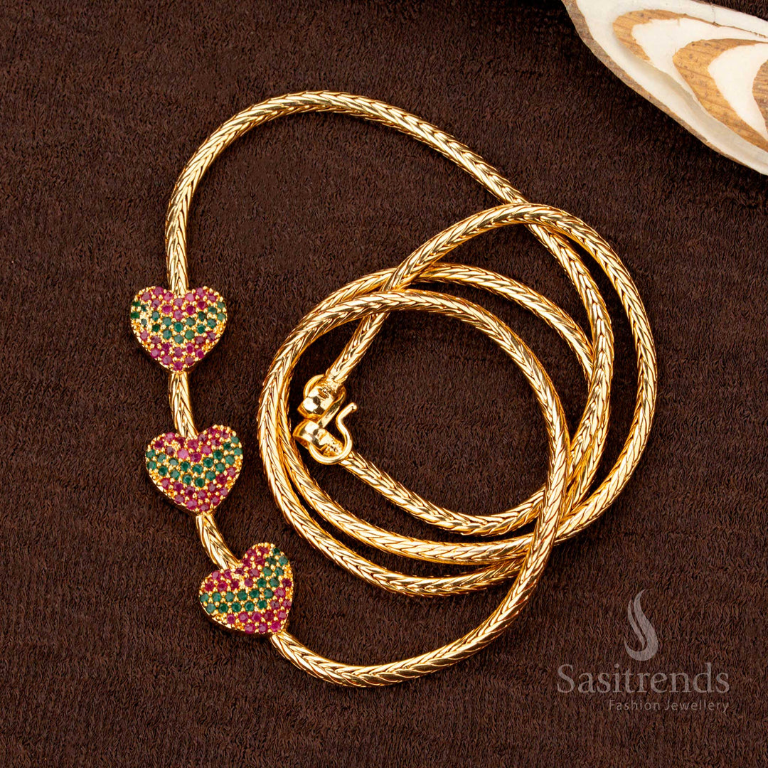 Stylish and elegant one-gram micro gold plated trio heart mugappu chain featuring dazzling ruby-green AD stones, a perfect blend of tradition and modern charm - Sasitrends