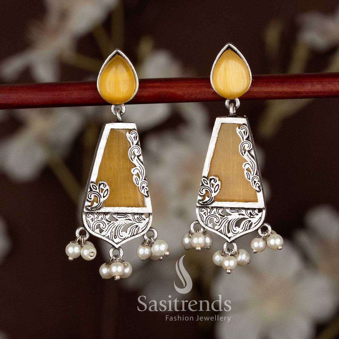 Bright yellow oxidised teardrop stud trapezoid drop earrings symbolising festive cheer, ideal for Navaratri and ethnic saree styling by Sasitrends