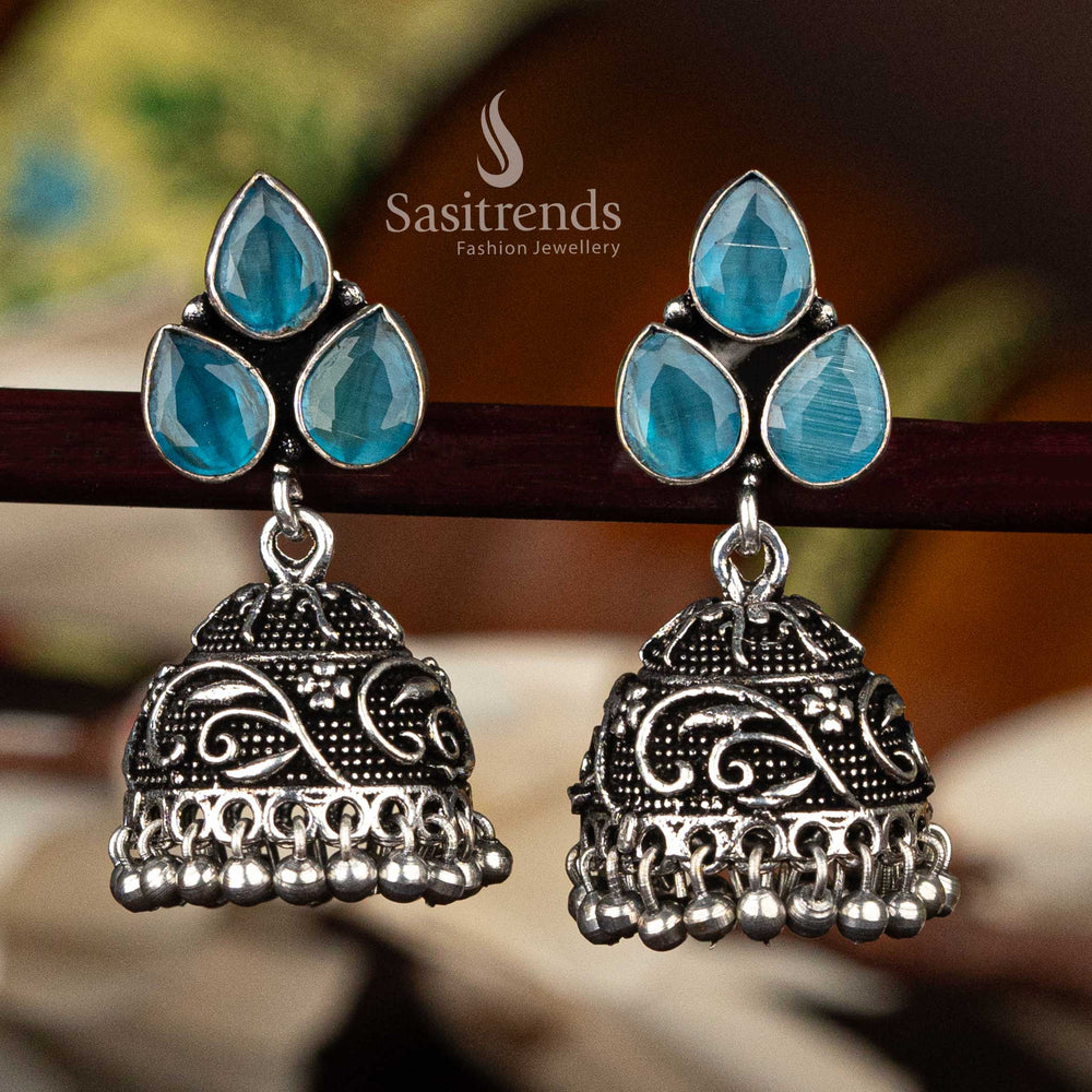 Traditional sky blue stone oxidised jhumka with floral leaf pattern and decorative bead fringe - Sasitrends
