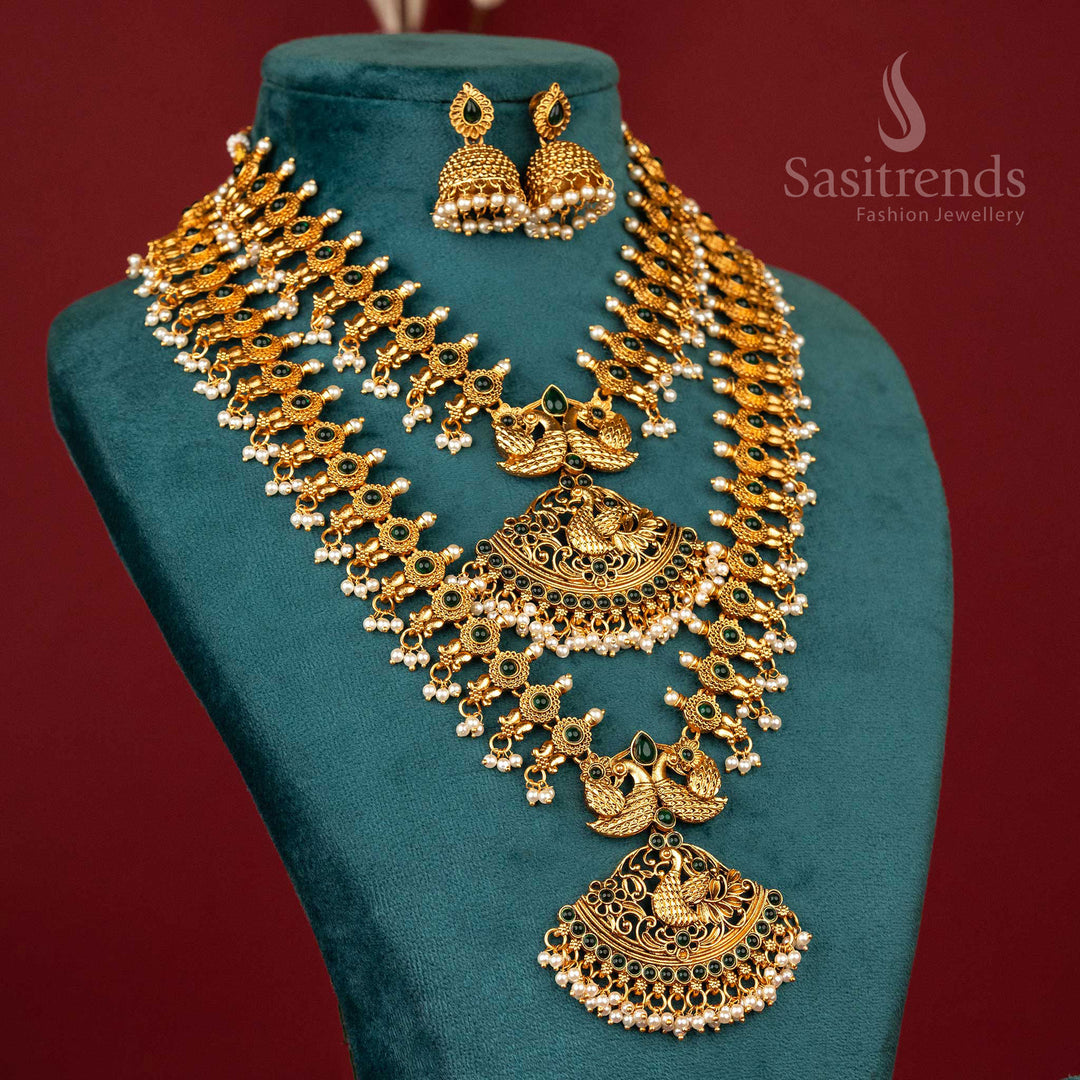 Elegant matte gold temple peacock combo necklace with green stones – perfect ethnic jewellery set with a divine look – sasitrends