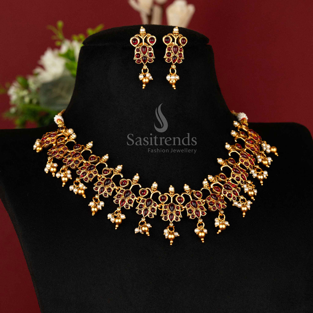 Classic temple-style necklace with ruby-studded Kemp stones in matte gold finish, paired with matching ethnic earrings – traditional jewellery charm – sasitrends