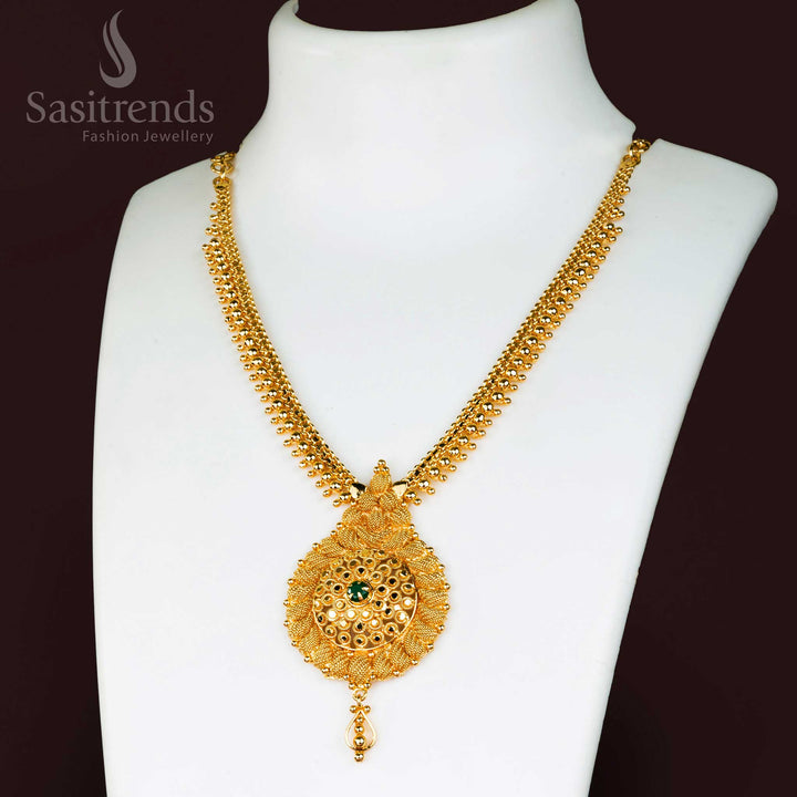 Splendid Micro Gold Plated Floral Pendant Necklace for Traditional Wear, beautifully embedded with vibrant Green Stones - Sasitrends