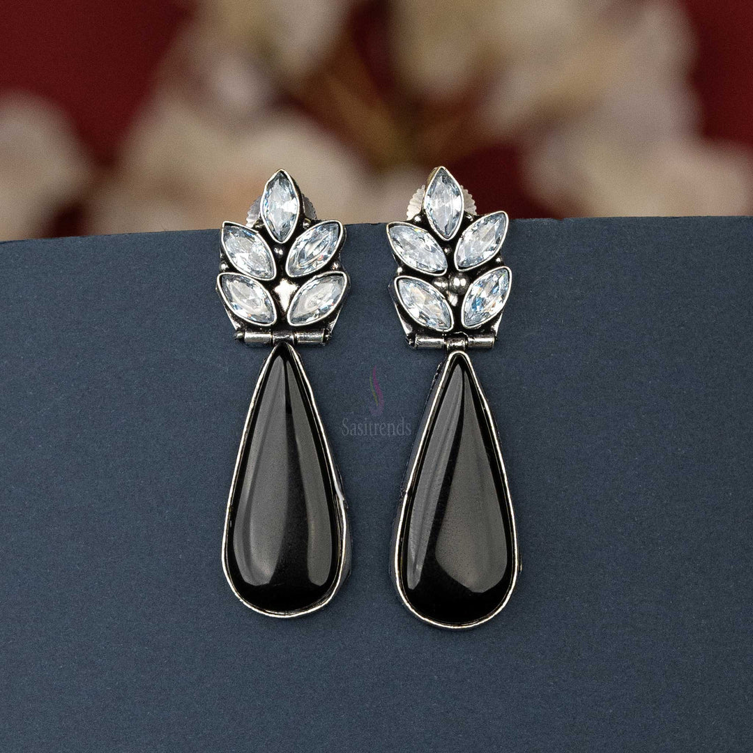 Chic oxidised silver earrings with black cabochon stone and AD stones, perfect for casual outings.