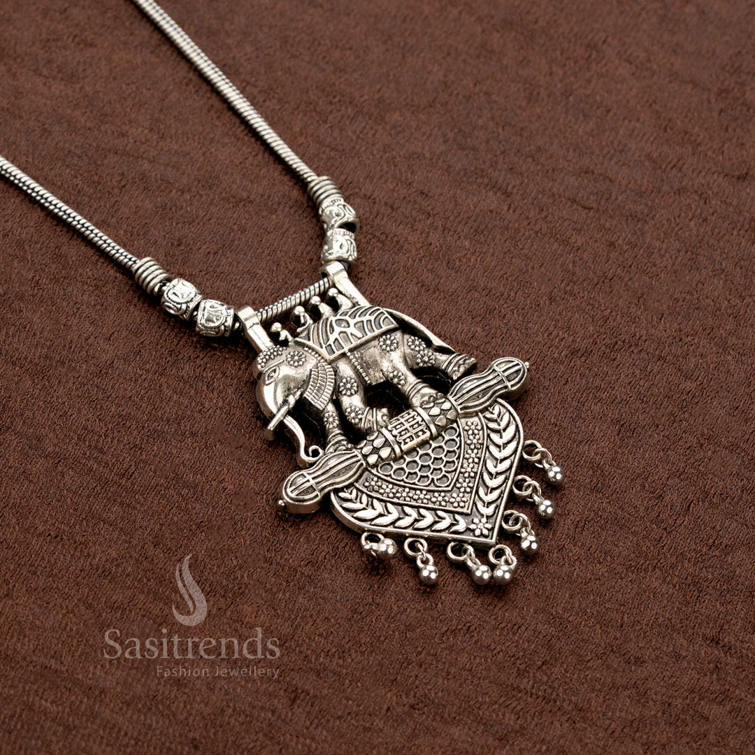 Oxidised tribal necklace featuring double elephant motifs with heart-shaped engraved pendant and antique ball hangings – Sasitrends
