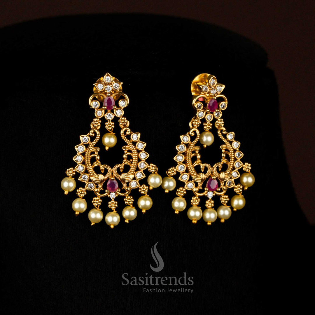 Opulent white-Ruby Matte Gold Plated Temple Drop Earrings with Artistic Filigree Design and Brilliant AD Stones, Ideal for Festive Celebrations – Sasitrends