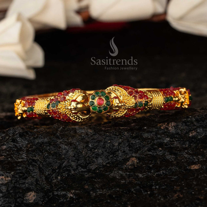 Exclusive micro gold-plated Peacock Lakshmi Kada bangle, intricately studded with ruby-green stones - Sasitrends