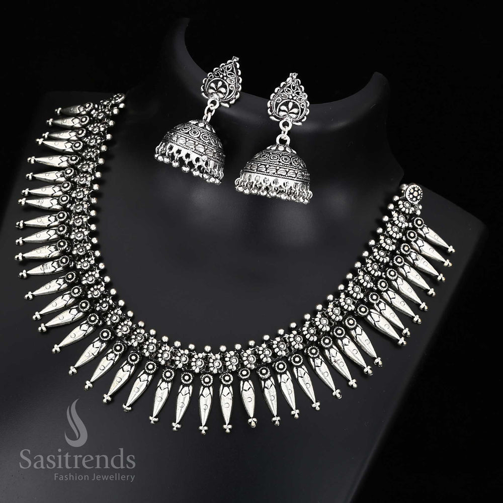 Artistic Kolhapuri oxidised silver jewellery set with engraved patterns and ornate charisma - Sasitrends