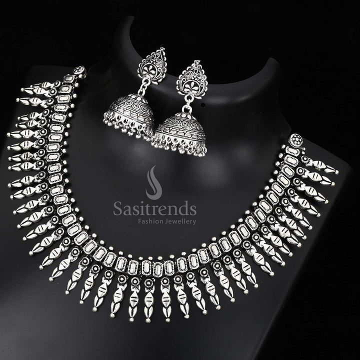 Ornamental Kolhapuri oxidised silver jewellery set with floral motifs and luxe detailing - Sasitrends


