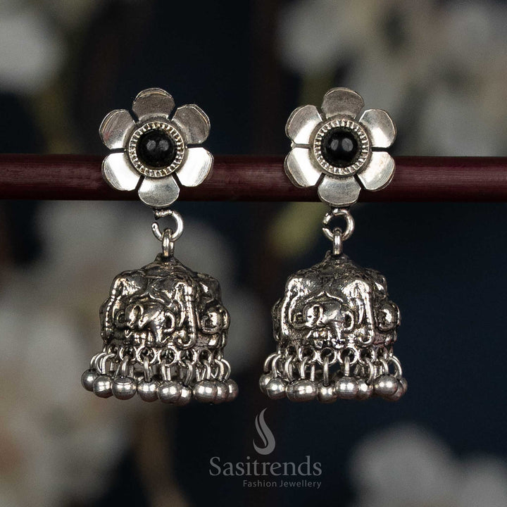 Oxidised Floral Stud Jhumka Earrings Featuring An Artistic Elephant Dome And Classic Ball Fringe, Embellished With Black Stone Detailing For A Bold Traditional Statement Look – Sasitrends