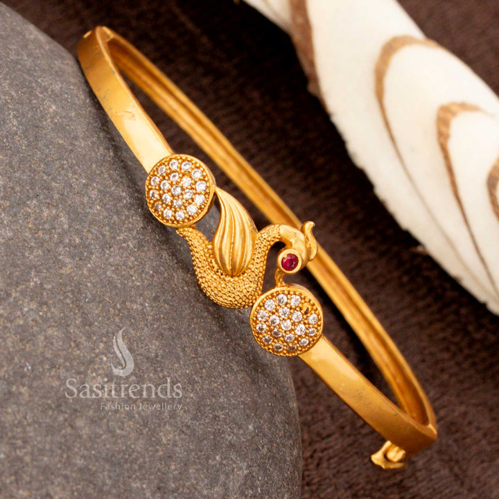 Radiant gold-plated openable peacock kada bracelet, intricately designed with shimmering white American diamonds, an exquisite cultural jewellery masterpiece - Sasitrends