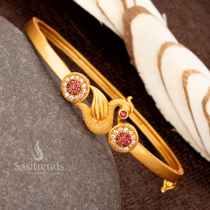 Ornate openable gold plated peacock kada bracelet featuring dazzling white-ruby American diamonds, an exquisite cultural jewellery masterpiece - Sasitrends