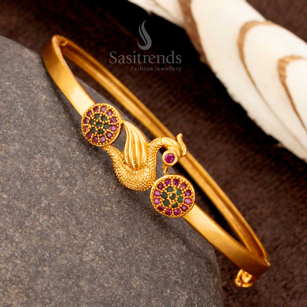 Elegant openable gold plated peacock kada bracelet, beautifully designed with gorgeous ruby-green stones, an ideal festive jewellery piece - Sasitrends