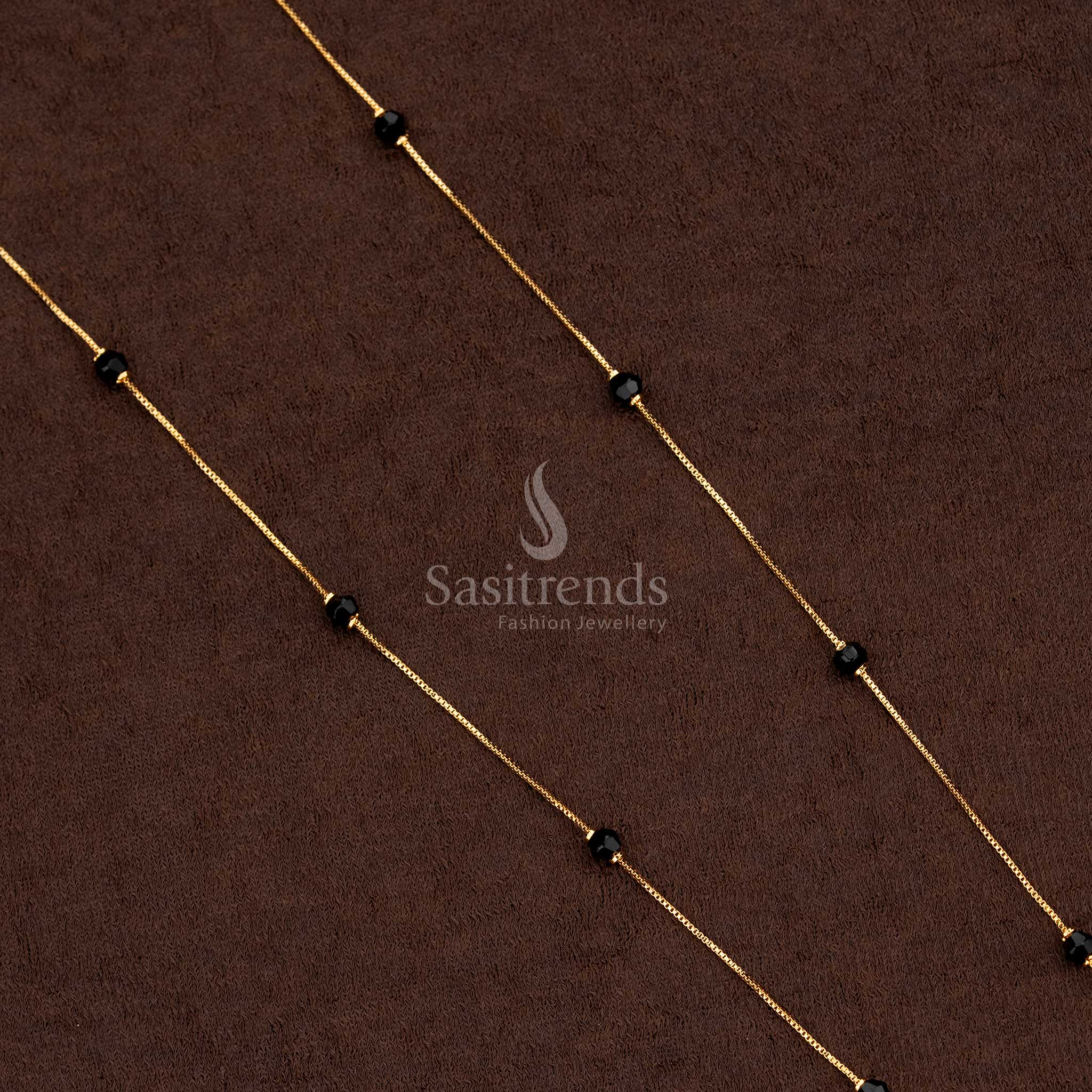 Delicate gold chain jewellery with small black bead accents.-Sasitrends
