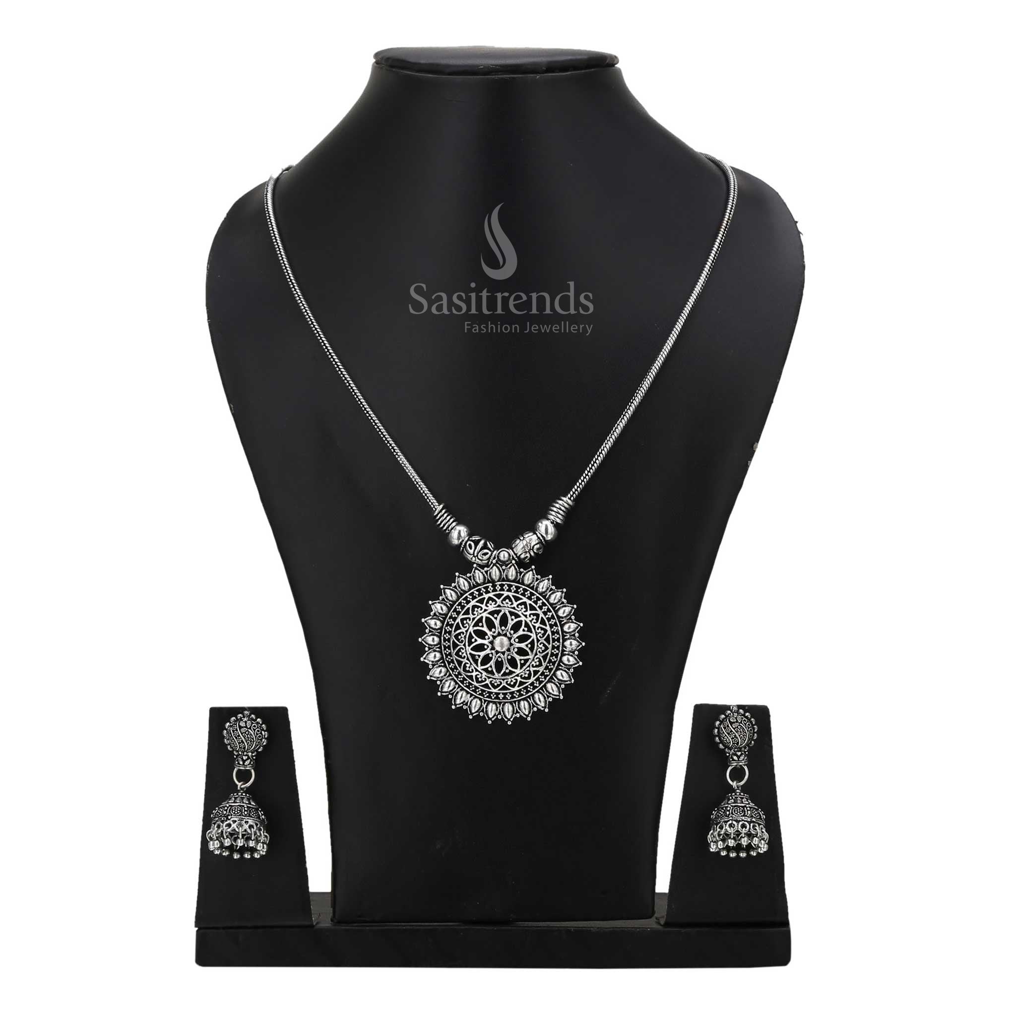 Regal oxidised silver Jhumka with statement tribal necklace jewellery set adorned with intricate motifs and antique gloss - Sasitrends