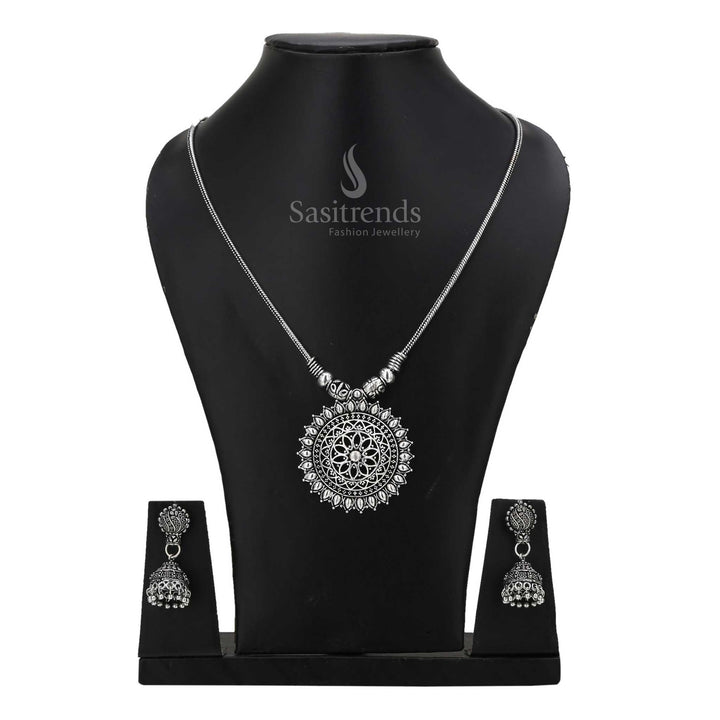 Regal oxidised silver Jhumka with statement tribal necklace jewellery set adorned with intricate motifs and antique gloss - Sasitrends