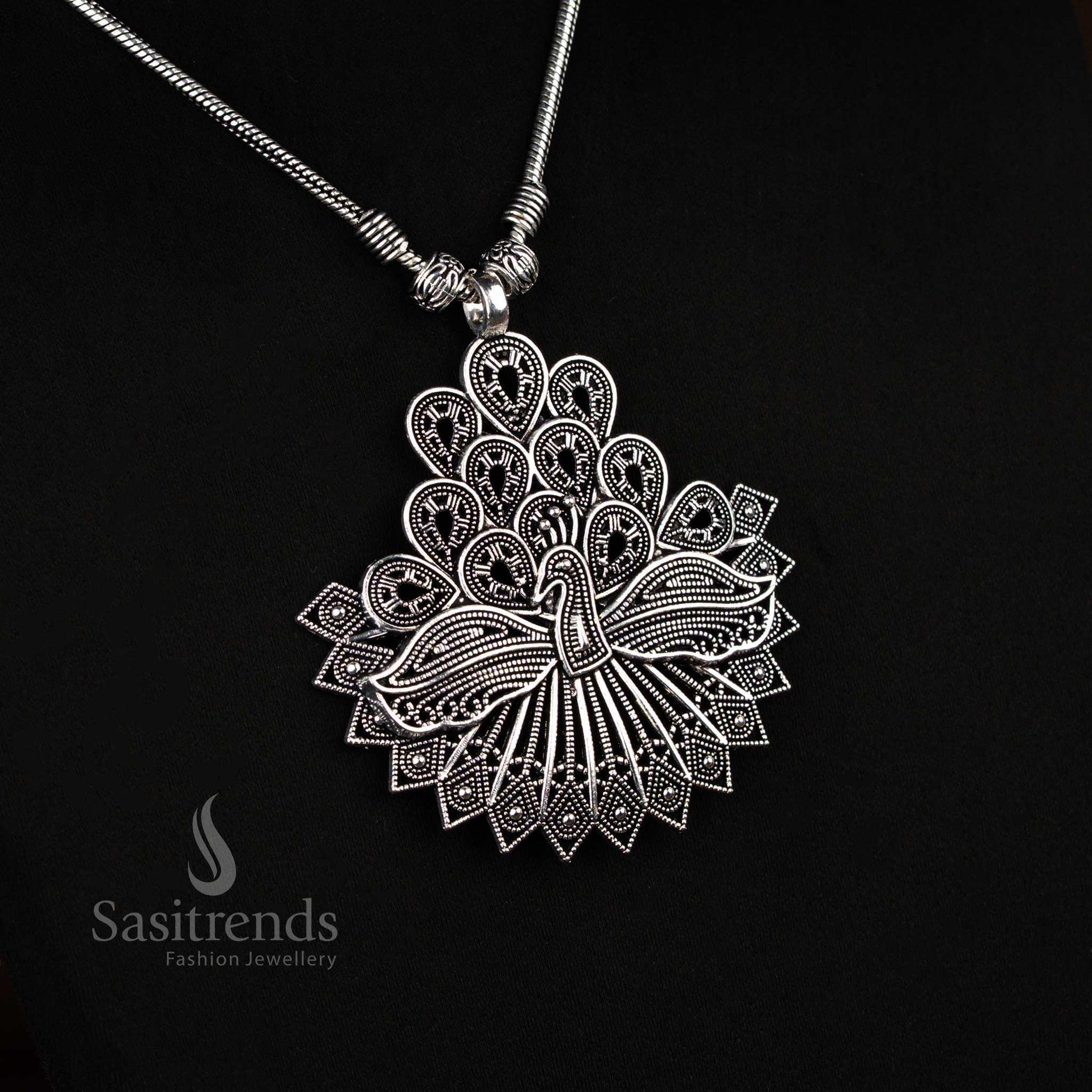 Elegant German silver oxidised chain necklace with antique feather peacock pendant, a traditional cultural jewellery piece for festive occasions – Sasitrends