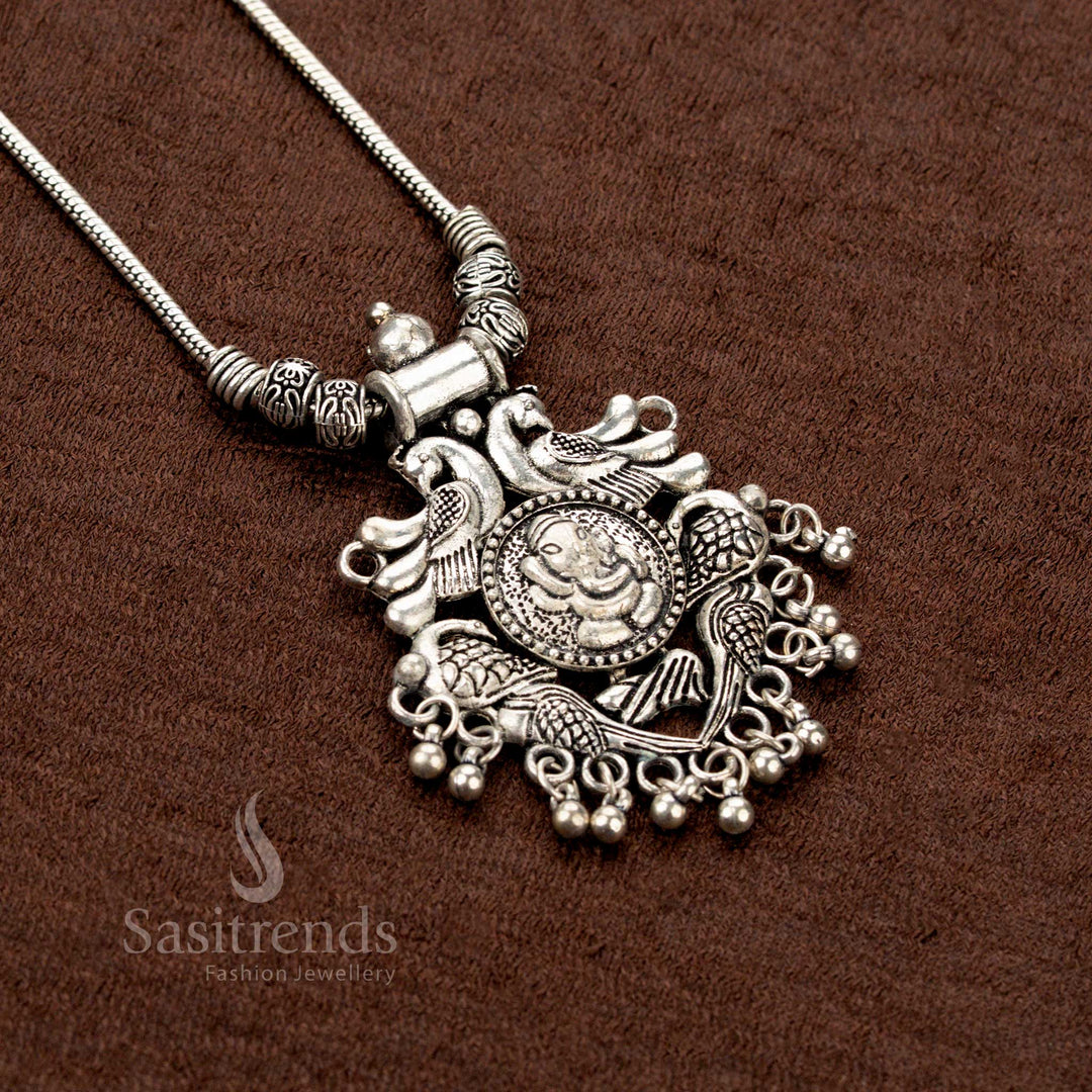 Spiritual elegance radiates from this oxidised chain necklace, featuring intricate Ganesha and peacock design with classic ball drops—a stunning piece of traditional Indian temple-style jewellery - Sasitrends