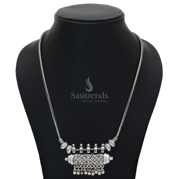 Oxidised silver chain necklace featuring a barrel-shaped tribal pendant with finely engraved antique ball hangings – a rustic ethnic jewellery piece perfect for fusion wear and folk celebrations – Sasitrends