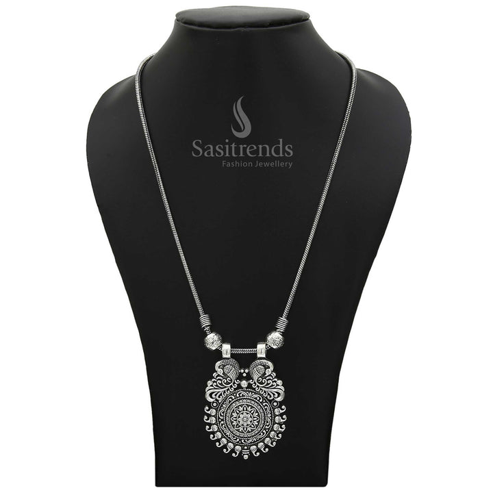 Regal aura necklace in a stunning blend of antique gold and oxidised silver, detailed with peacock artistry, floral petals, and mango-inspired curves – a dramatic traditional statement jewellery piece for cultural grandeur – Sasitrends