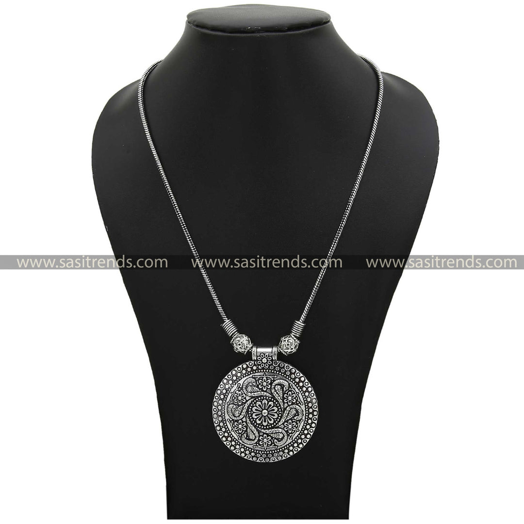 Artisanal necklace pendant with intricate peacock and flower details in oxidised finish - Sasitrends