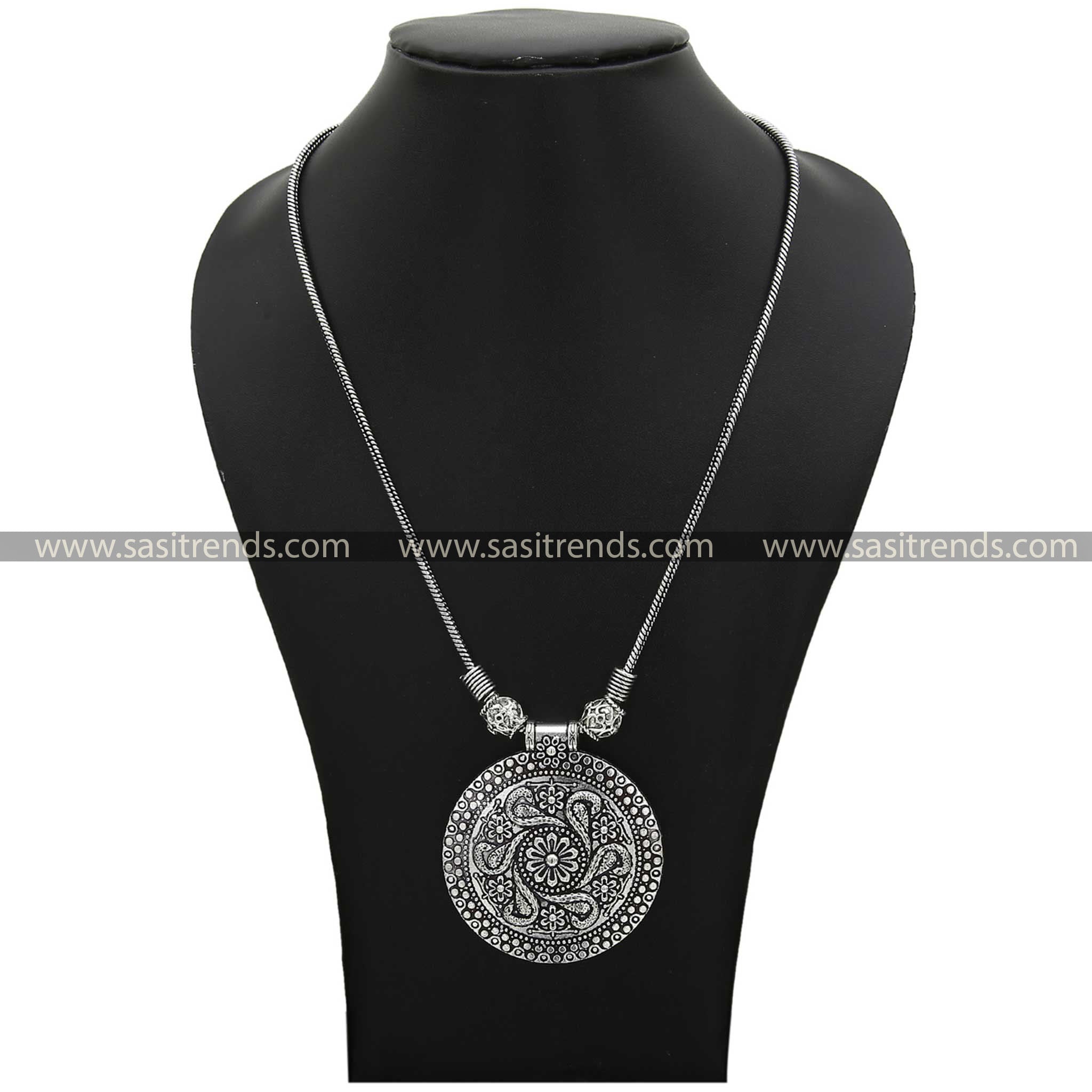 Artisanal necklace pendant with intricate peacock and flower details in oxidised finish - Sasitrends