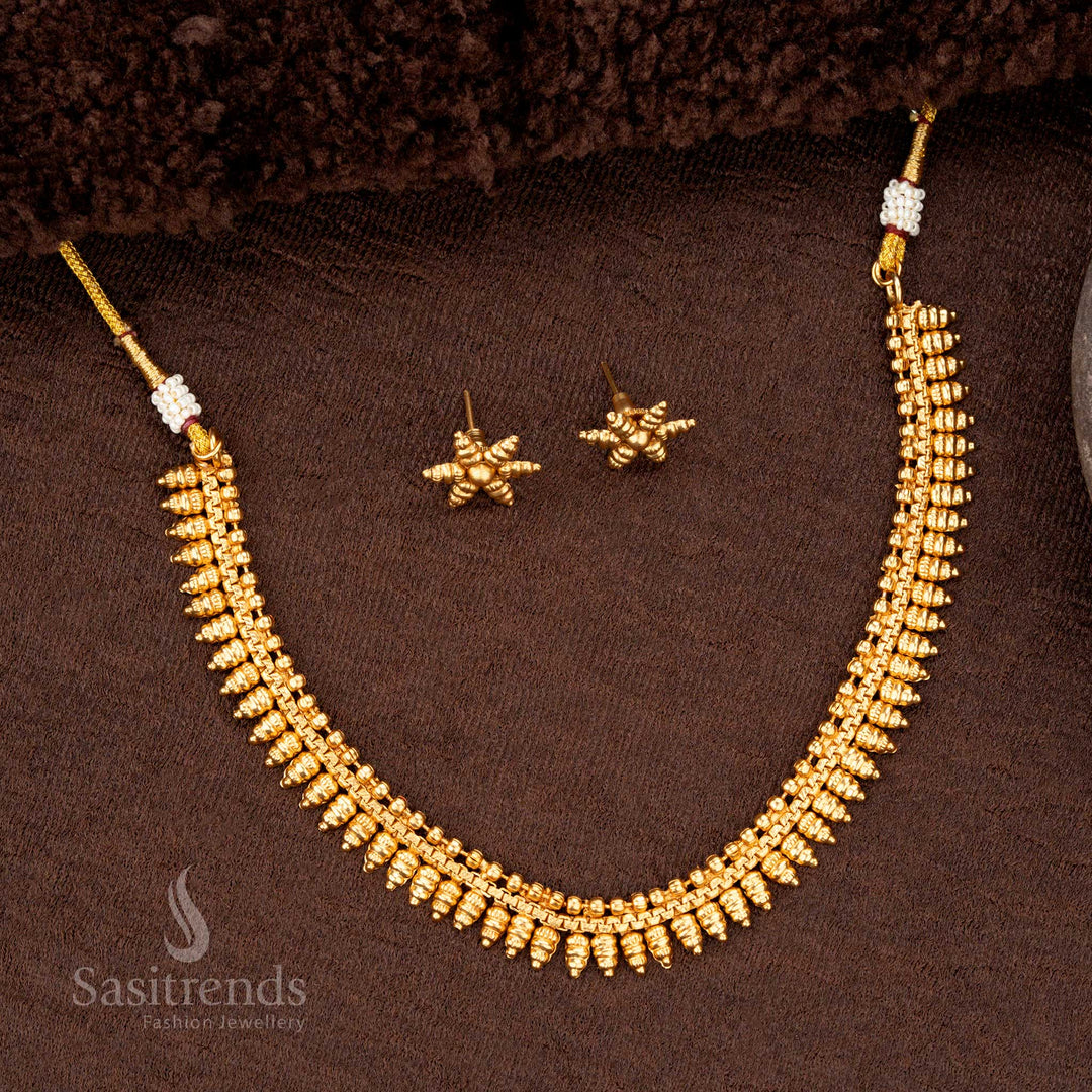 Ethereal traditional matte gold plated necklace with delicate and artistic dangling motif details ideal for festive celebrations - Sasitrends