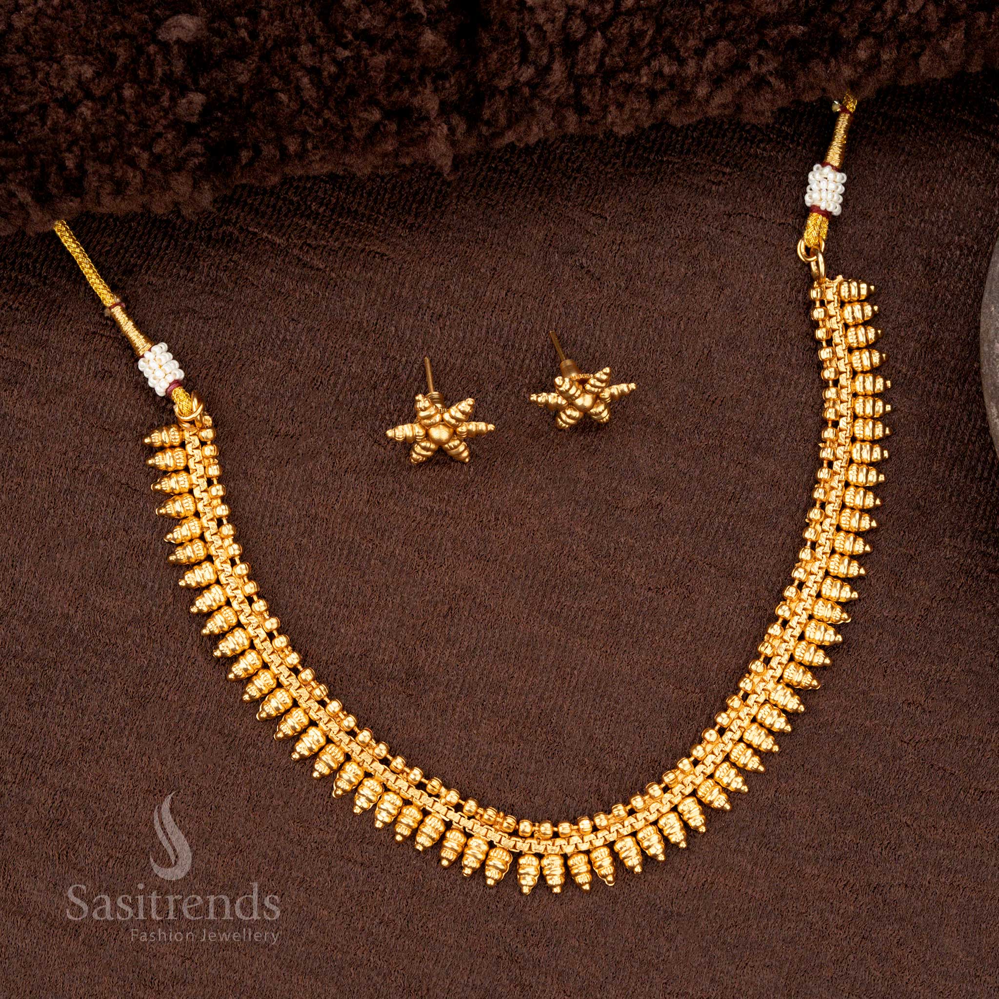 Ethereal traditional matte gold plated necklace with delicate and artistic dangling motif details ideal for festive celebrations - Sasitrends