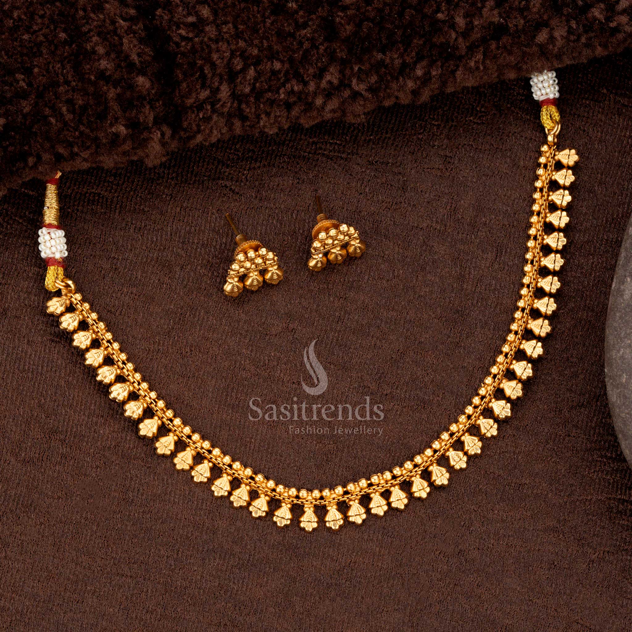 Elegant gold plated necklace set featuring a blend of floral patterns and ball designs ideal for special festive occasions - Sasitrends