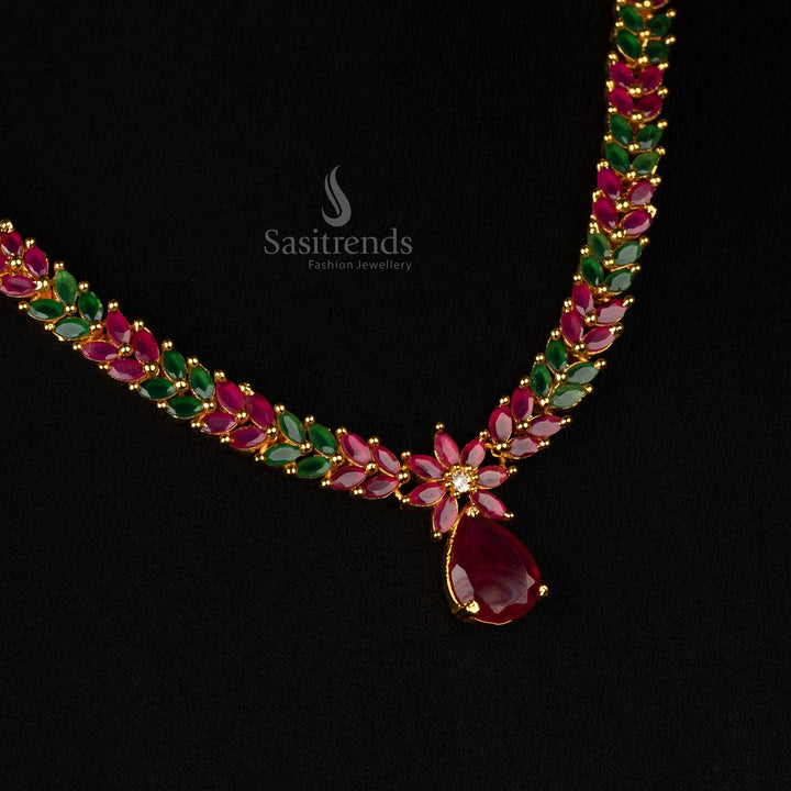 Sophisticated jewellery set with ruby-green stones, gold finish, and marquise-cut diamonds in leaf motifs - Sasitrends