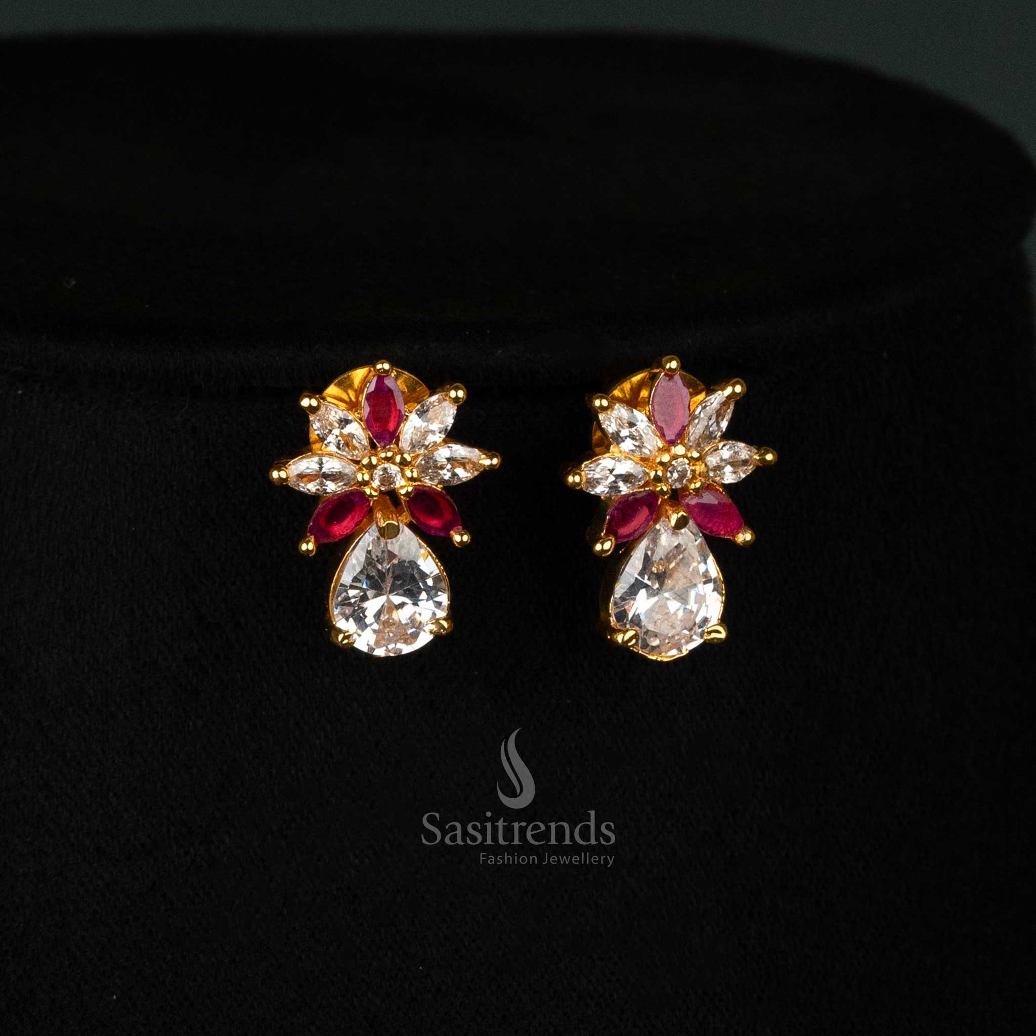 Graceful ruby-white earrings set in gold plating, showcasing marquise-cut American diamonds and an elegant leaf design - Sasitrends
