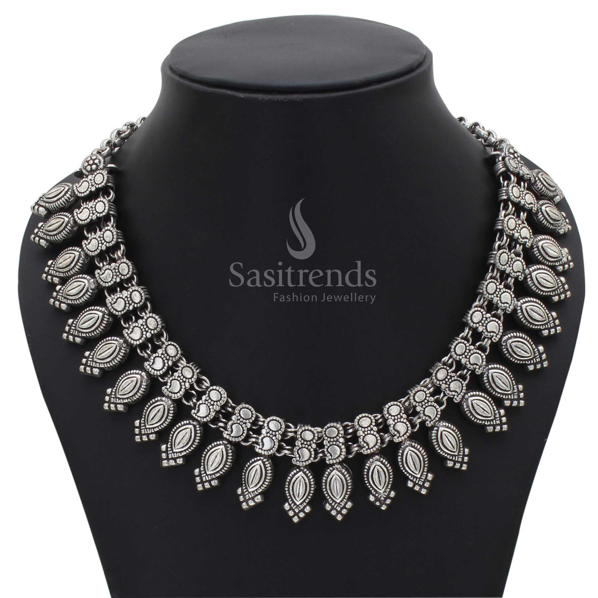 Elegant Kolhapuri oxidised silver necklace design for women and girls, blending traditional craftsmanship with fusion jewellery styling for festive wear - Sasitrends