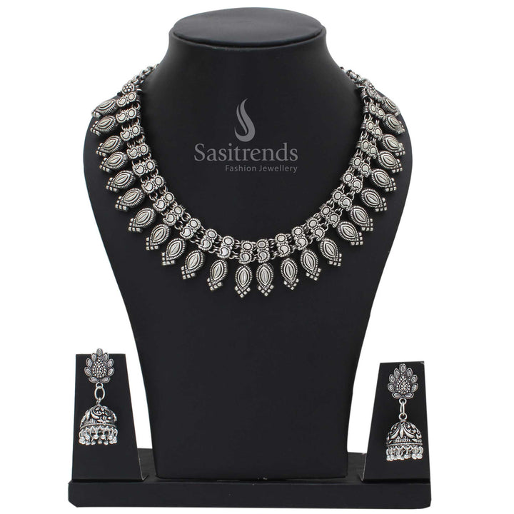 Rustic oxidised German silver Kolhapuri necklace and earrings jewellery set with vintage coin motifs and bohemian fusion styling for traditional luxe - Sasitrends