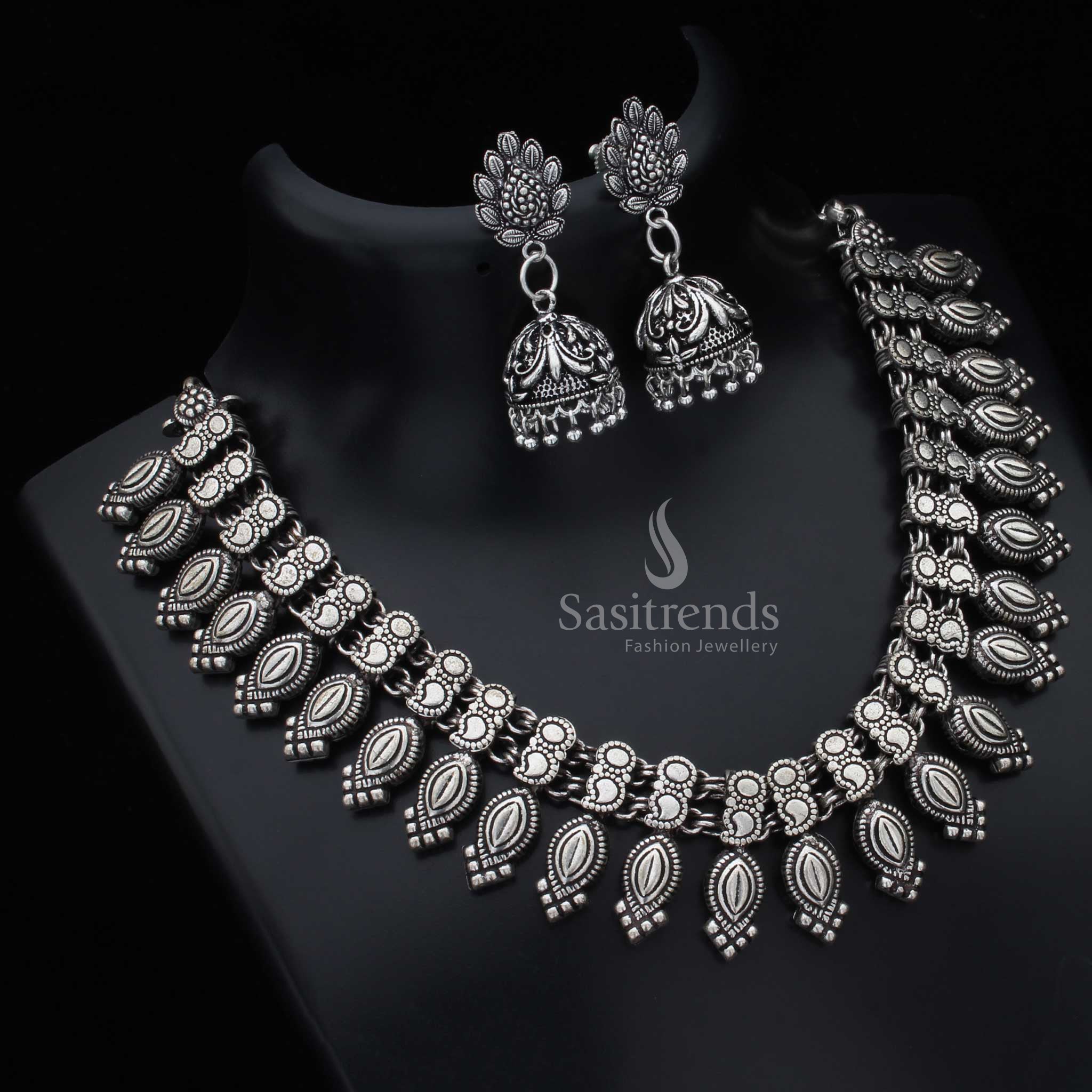 Kolhapuri oxidised silver tribal German silver necklace with matching earrings jewellery set featuring etched motifs and handcrafted boho charisma - Sasitrends

