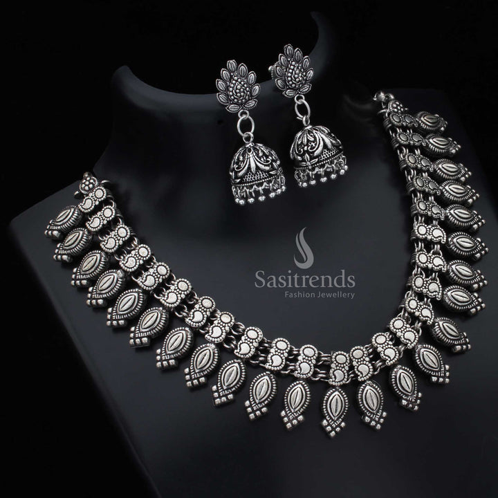 Kolhapuri oxidised silver tribal German silver necklace with matching earrings jewellery set featuring etched motifs and handcrafted boho charisma - Sasitrends

