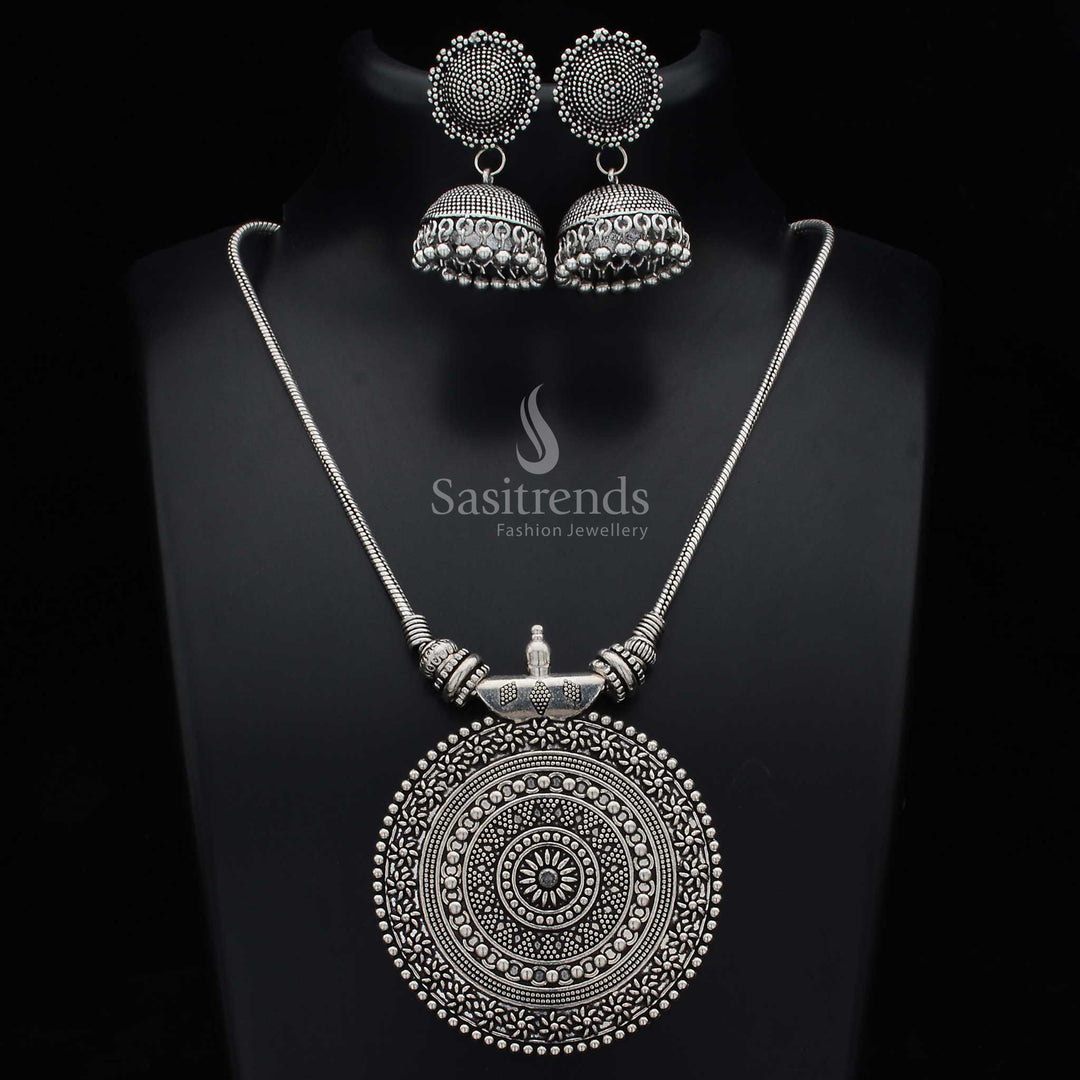 Oxidised German silver Nayanthara chakra pendant jewellery set with statement jhumkas and intricate fusion artwork for festival and fusion wear - Sasitrends