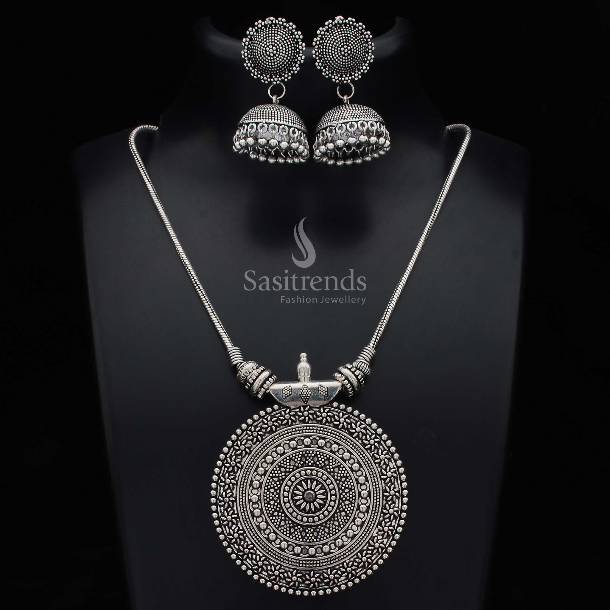 Oxidised German silver Nayanthara chakra pendant jewellery set with statement jhumkas and intricate fusion artwork for festival and fusion wear - Sasitrends