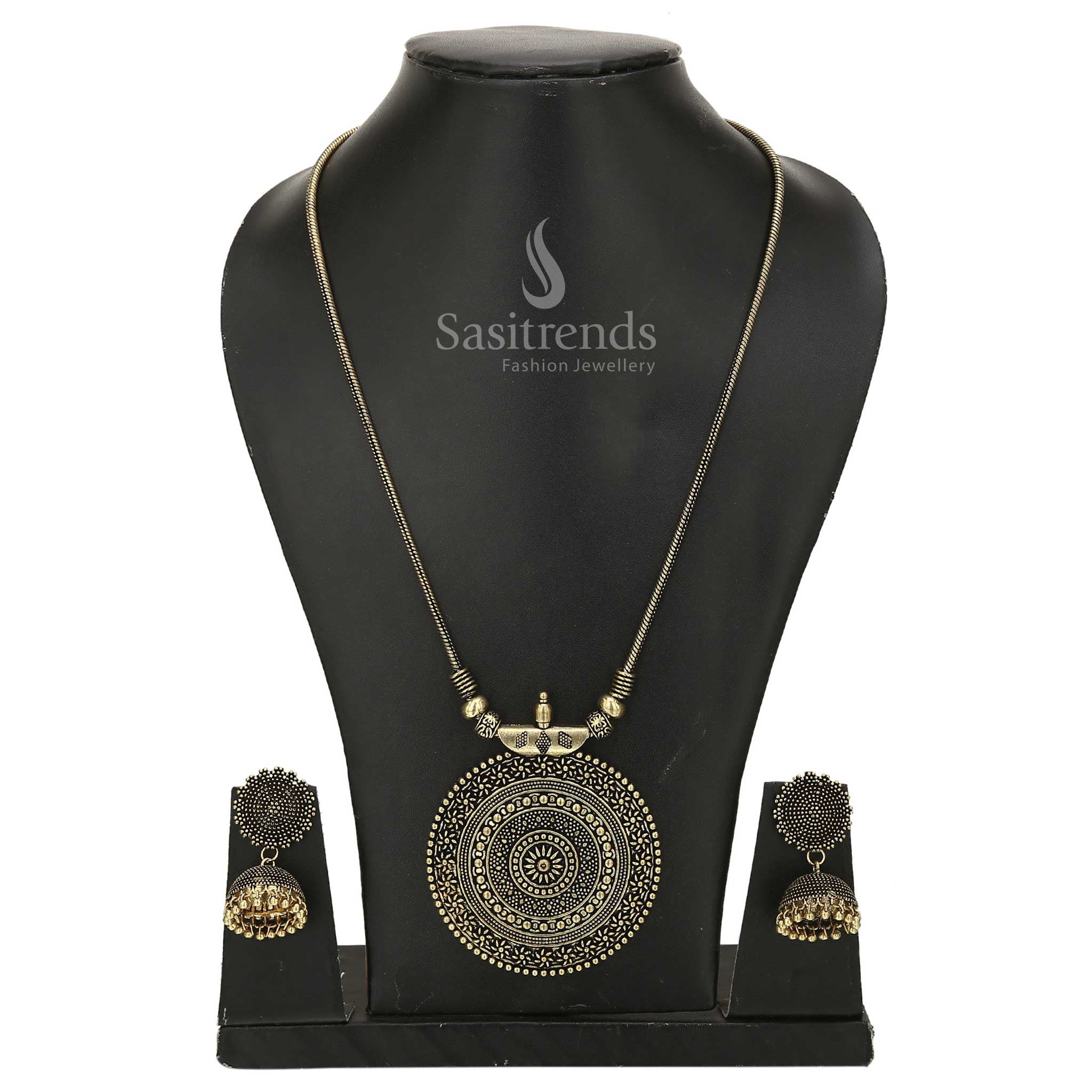 Antique gold Nayanthara chakra pendant chain jewellery set with traditional jhumka earrings and divine symbolic motif in temple matte finish - Sasitrends