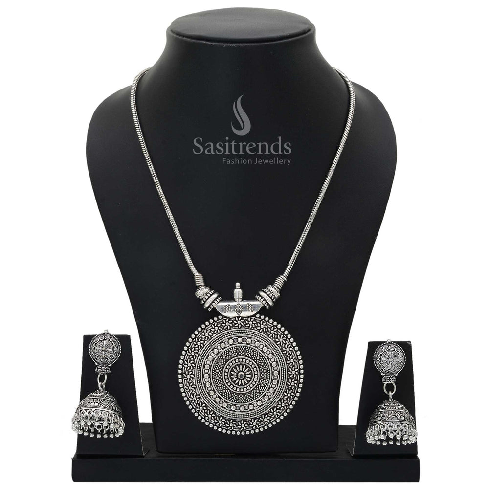 Roopasi oxidised silver chakra pendant chain jewellery set with tribal motif and bohemian jhumka earrings for fusion looks and festive finesse - Sasitrends