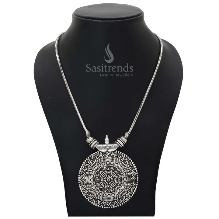 Striking oxidised chain necklace featuring an engraved Roopasi chakra pendant with floral detailing and rustic tribal aesthetics – Sasitrends