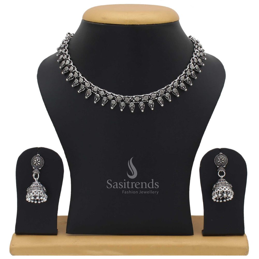Taruni oxidised silver choker jewellery set with jhumka for women featuring tribal motif and boho fusion touch with vintage engraved floral accents - Sasitrends