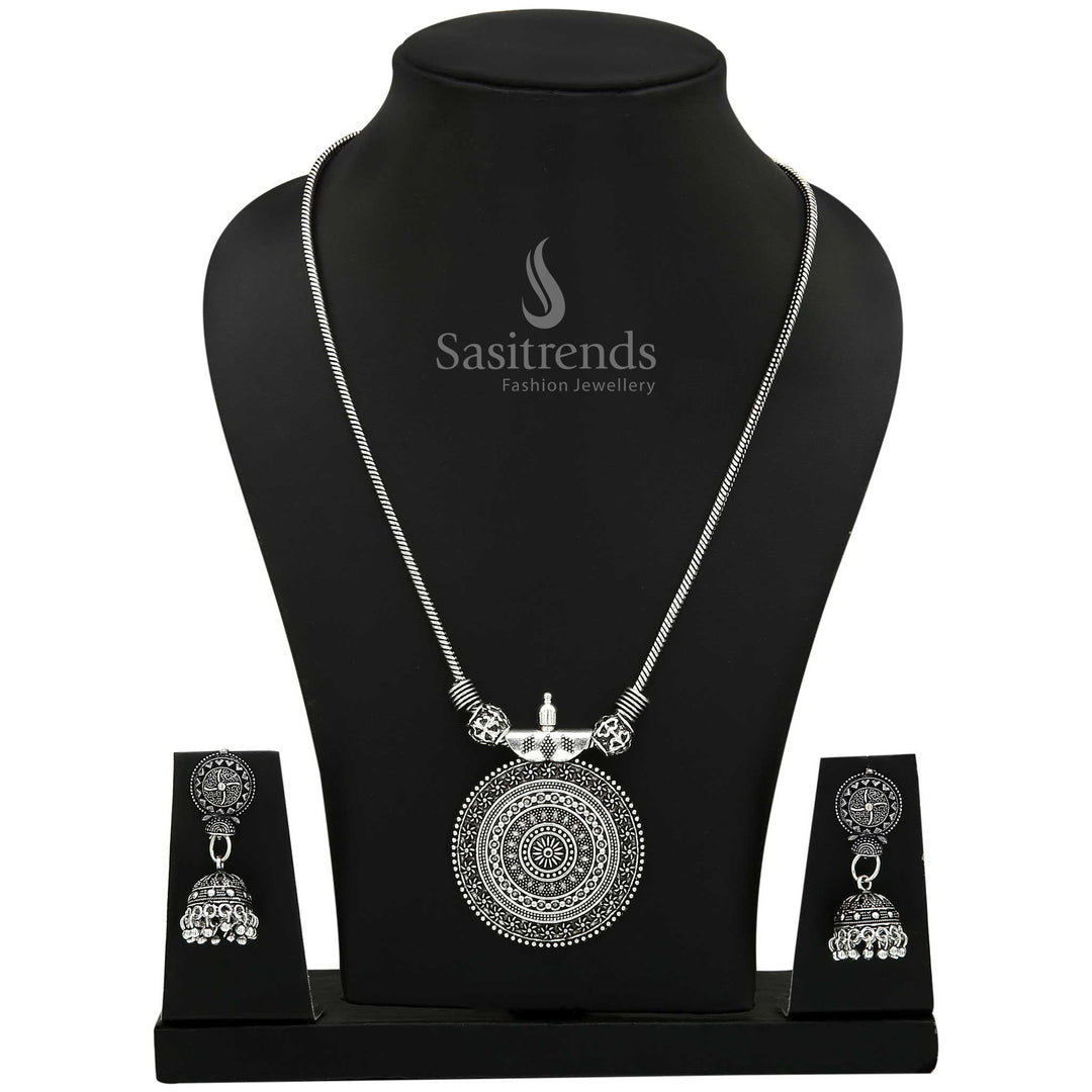 Rustic Oxidised Silver Roopasi Chakra Pendant Necklace with matching Jhumkas showcasing boho flair and vintage-inspired detailing—ethnic jewellery designed for free-spirited girls – Sasitrends