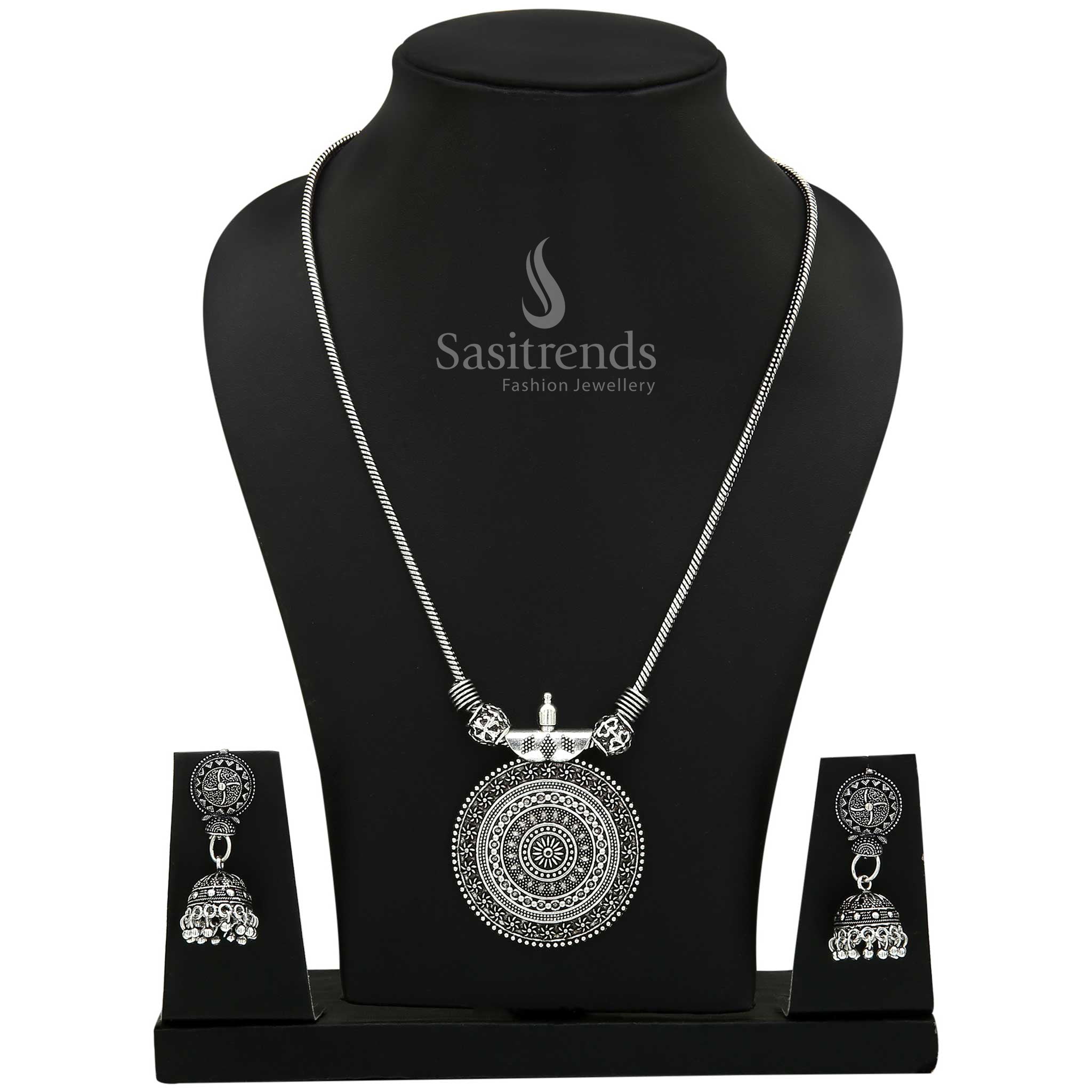 Rustic Oxidised Silver Roopasi Chakra Pendant Necklace with matching Jhumkas showcasing boho flair and vintage-inspired detailing—ethnic jewellery designed for free-spirited girls – Sasitrends
