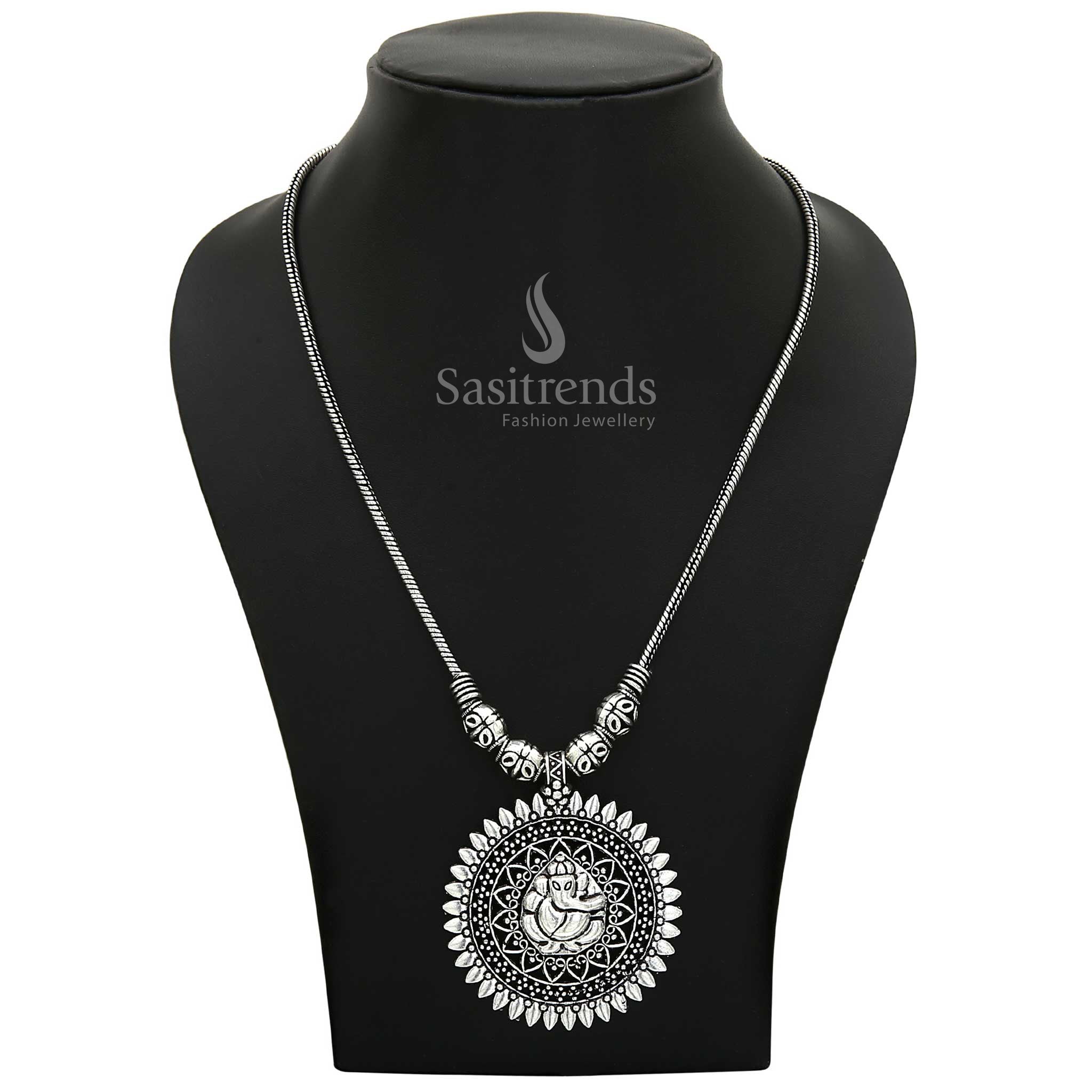 Sacred Oxidised Silver Ganesha Pendant on a long necklace chain with elegant handcrafted detailing—a spiritual jewellery piece ideal for festive and devotional occasions – Sasitrends
