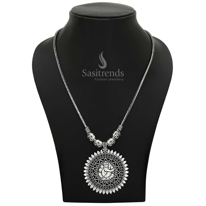 Sacred Oxidised Silver Ganesha Pendant on a long necklace chain with elegant handcrafted detailing—a spiritual jewellery piece ideal for festive and devotional occasions – Sasitrends