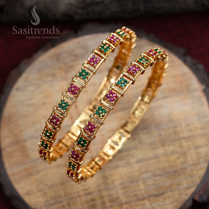 Designer micro gold floral motif bangles pair, artistically studded with ruby-green American diamonds - Sasitrends